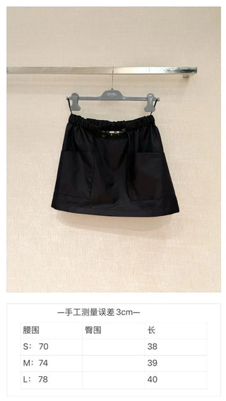 New arrival: Workwear-style half-skirt with belt and pockets.