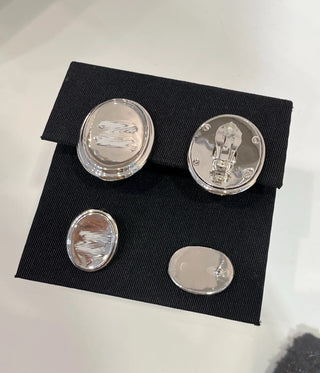 White enamel double C mirrored oval button earrings