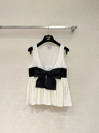 new bow-tie top is made of 100% silk.