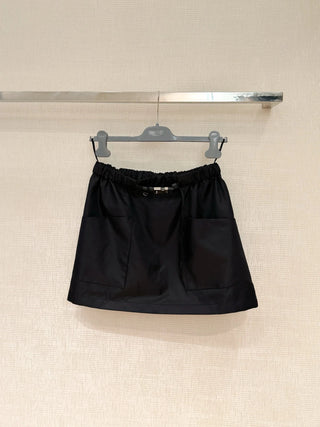 New arrival: Workwear-style half-skirt with belt and pockets.