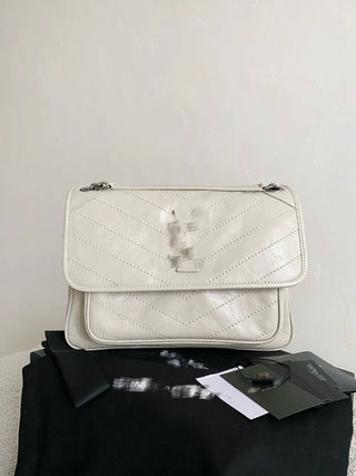 niki waxed leather cream medium