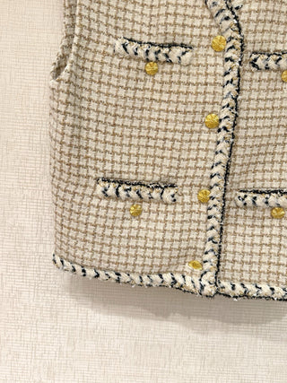 Chane* 25K lace vest features classic tweed trim with delicate chain lace accents and a silk lining.