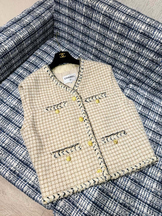 Chane* 25K lace vest features classic tweed trim with delicate chain lace accents and a silk lining.