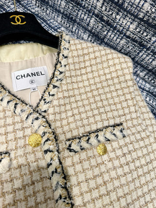 Chane* 25K lace vest features classic tweed trim with delicate chain lace accents and a silk lining.