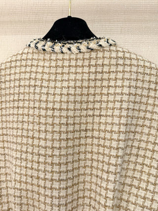 Chane* 25K lace vest features classic tweed trim with delicate chain lace accents and a silk lining.