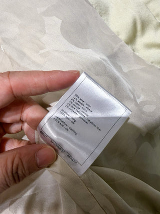 Chane* 25K lace vest features classic tweed trim with delicate chain lace accents and a silk lining.