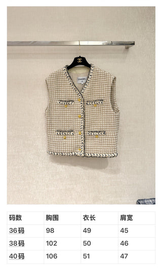 Chane* 25K lace vest features classic tweed trim with delicate chain lace accents and a silk lining.