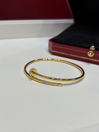 New gold bracelet with rhinestone-studded thin nail design