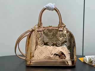 Small gold-plated patent leather shell bag