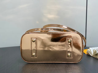 Small gold-plated patent leather shell bag