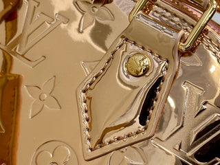 Small gold-plated patent leather shell bag