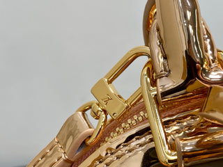 Small gold-plated patent leather shell bag