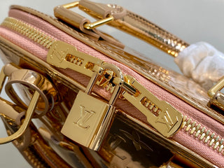 Small gold-plated patent leather shell bag