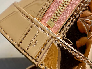 Small gold-plated patent leather shell bag