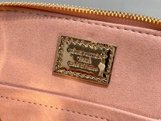 Small gold-plated patent leather shell bag