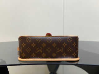 monogrammed leather baguette bag with shoulder strap