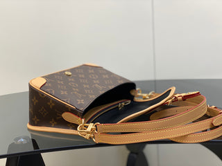 monogrammed leather baguette bag with shoulder strap