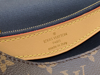 monogrammed leather baguette bag with shoulder strap