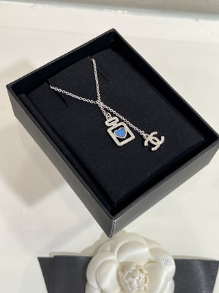 𝑪𝒉𝒂𝒏𝒆 * 25P New Model: Blue Heart with Silver Accents and Full Diamonds – Double C Perfume Bottle Necklace.