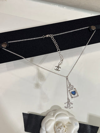 𝑪𝒉𝒂𝒏𝒆 * 25P New Model: Blue Heart with Silver Accents and Full Diamonds – Double C Perfume Bottle Necklace.