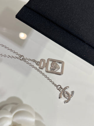 𝑪𝒉𝒂𝒏𝒆 * 25P New Model: Blue Heart with Silver Accents and Full Diamonds – Double C Perfume Bottle Necklace.