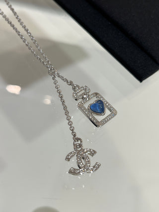 𝑪𝒉𝒂𝒏𝒆 * 25P New Model: Blue Heart with Silver Accents and Full Diamonds – Double C Perfume Bottle Necklace.