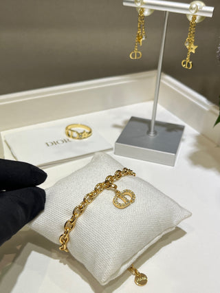 𝐃𝐢𝐨 * 25-year-old, fully encrusted CD pendant in champagne gold with a bracelet.