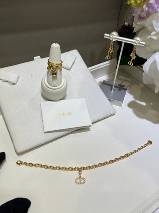 𝐃𝐢𝐨 * 25-year-old, fully encrusted CD pendant in champagne gold with a bracelet.