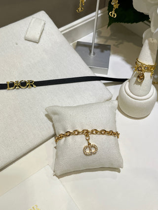 𝐃𝐢𝐨 * 25-year-old, fully encrusted CD pendant in champagne gold with a bracelet.