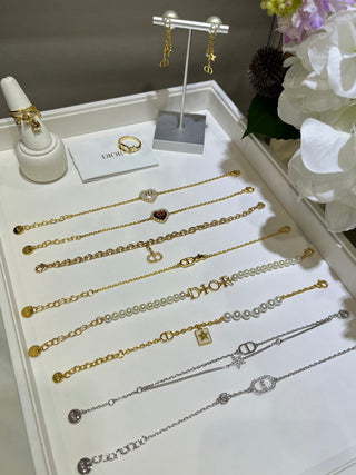 𝐃𝐢𝐨 * 25-year-old, fully encrusted CD pendant in champagne gold with a bracelet.