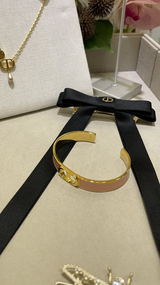 Dio* New Gold CD Letter Pink Enamel Open Bangle