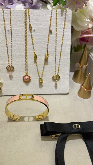 Dio* New Gold CD Letter Pink Enamel Open Bangle