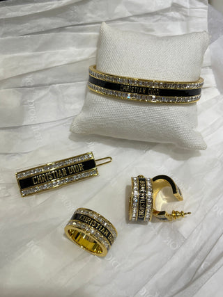 𝐃𝐢𝐨 * 25-year-old, new model, black enamel, gold-plated, letter-patterned, open-faced bracelet.