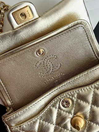 Chanel 25A ultra-mini cf pendant bag, gold color.