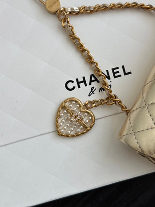 Chanel 25A ultra-mini cf pendant bag, gold color.