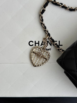 Chanel 25A ultra-mini CF hang-on bag, black.